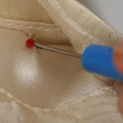 How to Open the Stitches on a Vest Pocket